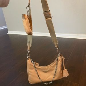 Prada Re-edition Nylon bag in cammeo beige.